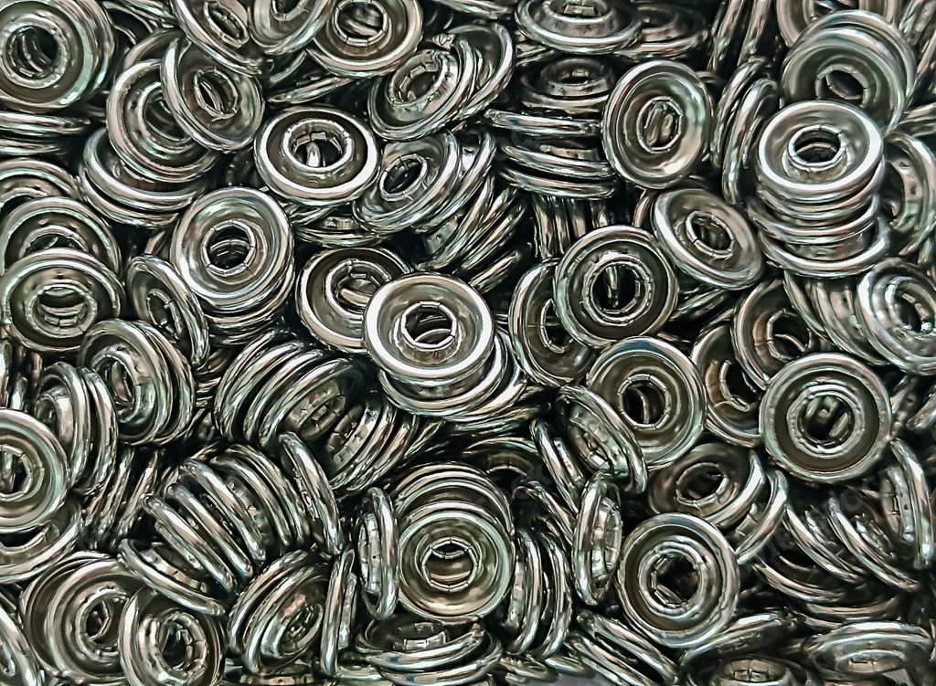A closeup of a bunch of shiny silver glass beads