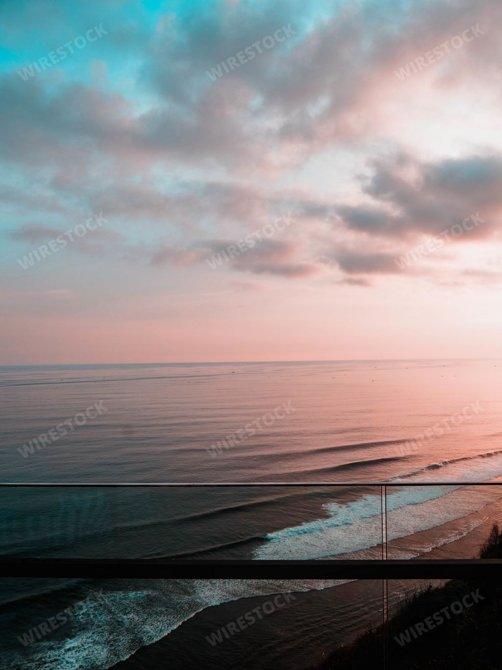 A mesmerizing view from the balcony, a cloudscape over the sea at sunset