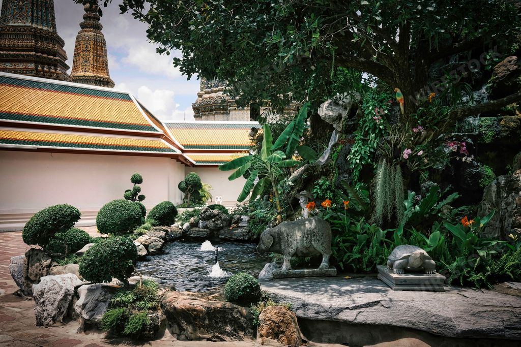 The beautiful view of park near the Wat Suthat Thepwararam temple in Bangkok, Thailand