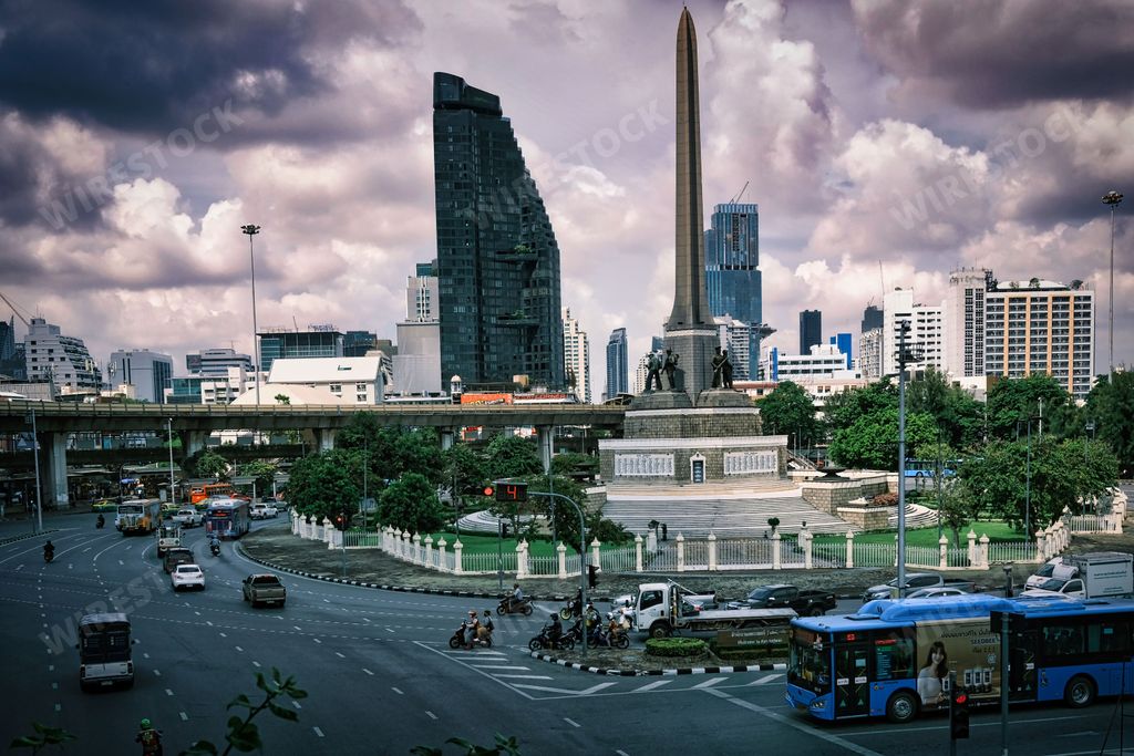 A high-angle shot of Bangkok city with buildings and skyscrapers cloudy sky in the background