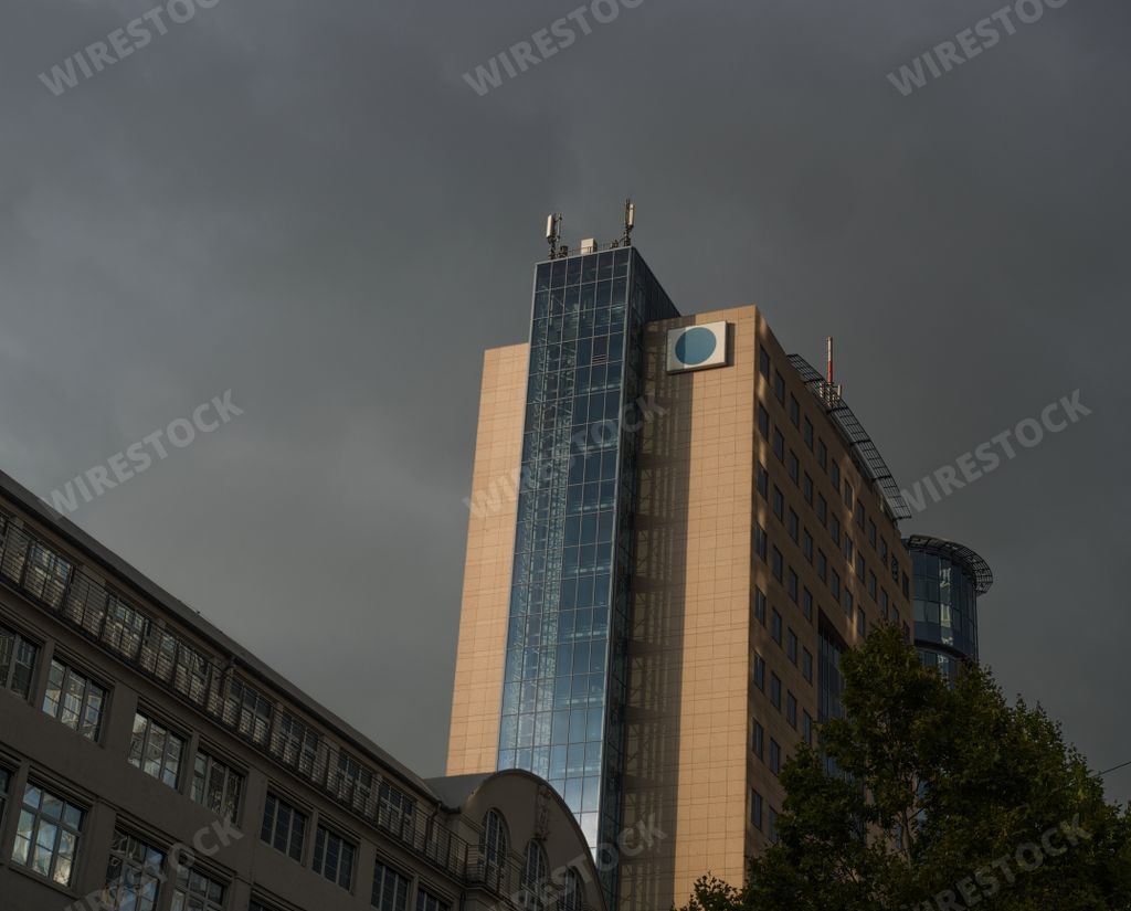 An eerie scenery of a high rise modern building under a dark sky in Germany