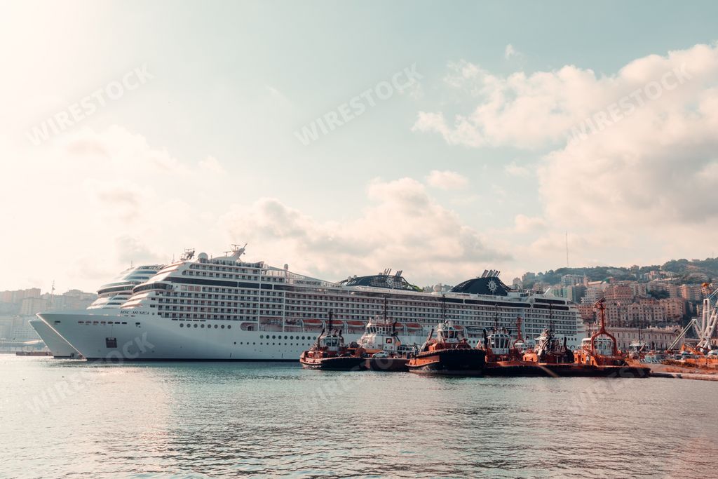 A scenic view of ships and boats in the ancient port of Genoa, Italy
