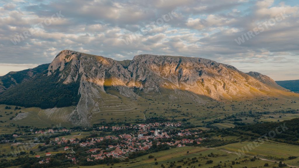 The Szekler Stone (Szekelyko, Piatra Secuiului) in Trascaului Mountains seen from Rimetea Village in Romania