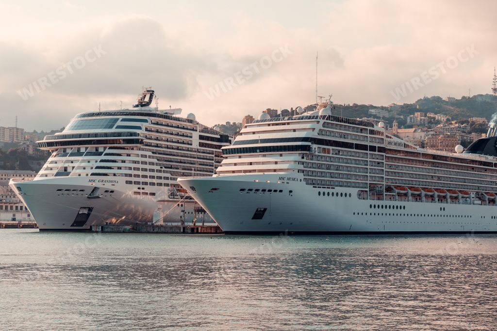 A scenic view of ships and boats in the ancient port of Genoa, Italy