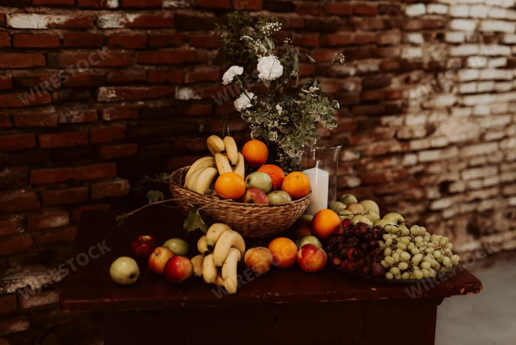 An assortment of fresh fruits on a wooden table