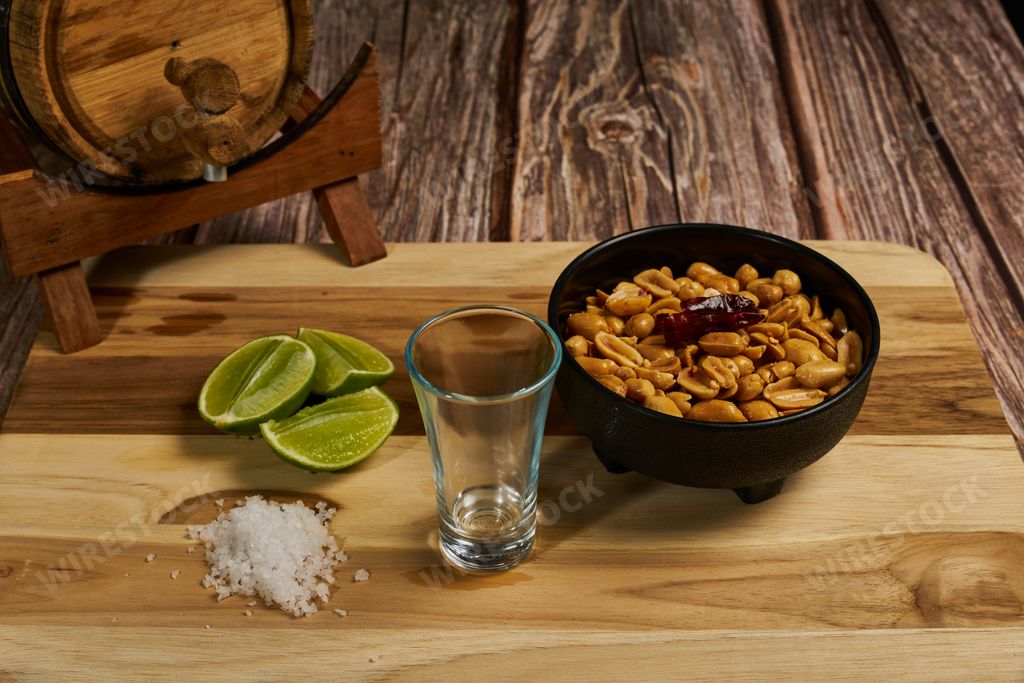 How to take a shot of tequila in Mexico with its lemon and salt and chili peanuts