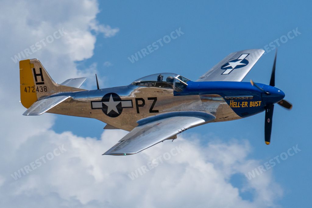 The P-51 Mustang Performing Aerobatics at Hill AFB in blue sky