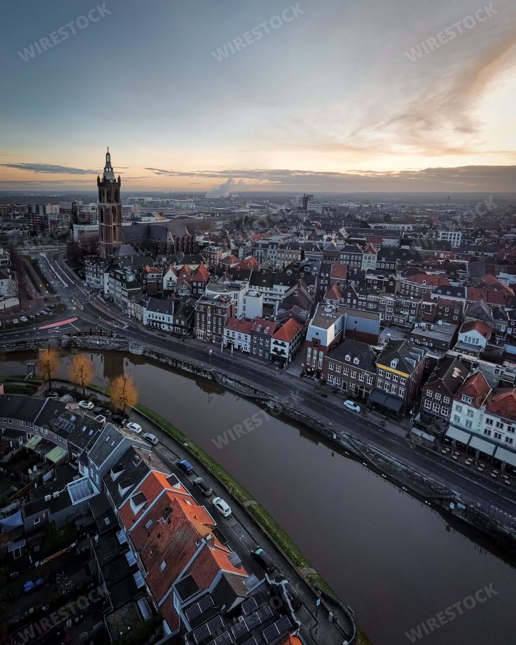 An aerial view of Roermond cityscape at foggy sunset in Netherlands
