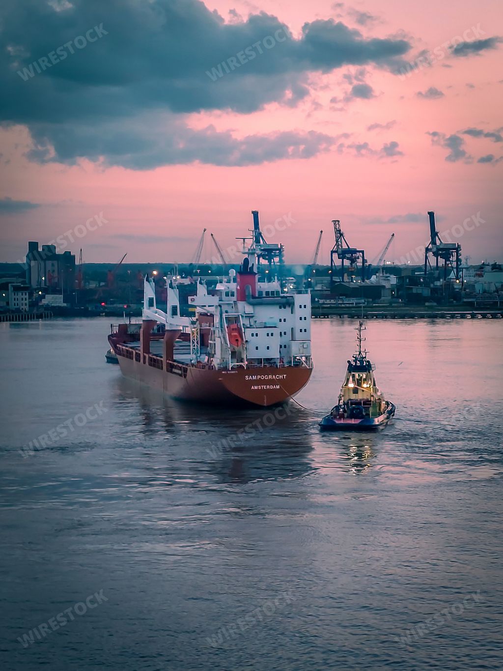 A closeup of a majestic white ship in the ocean at sunset