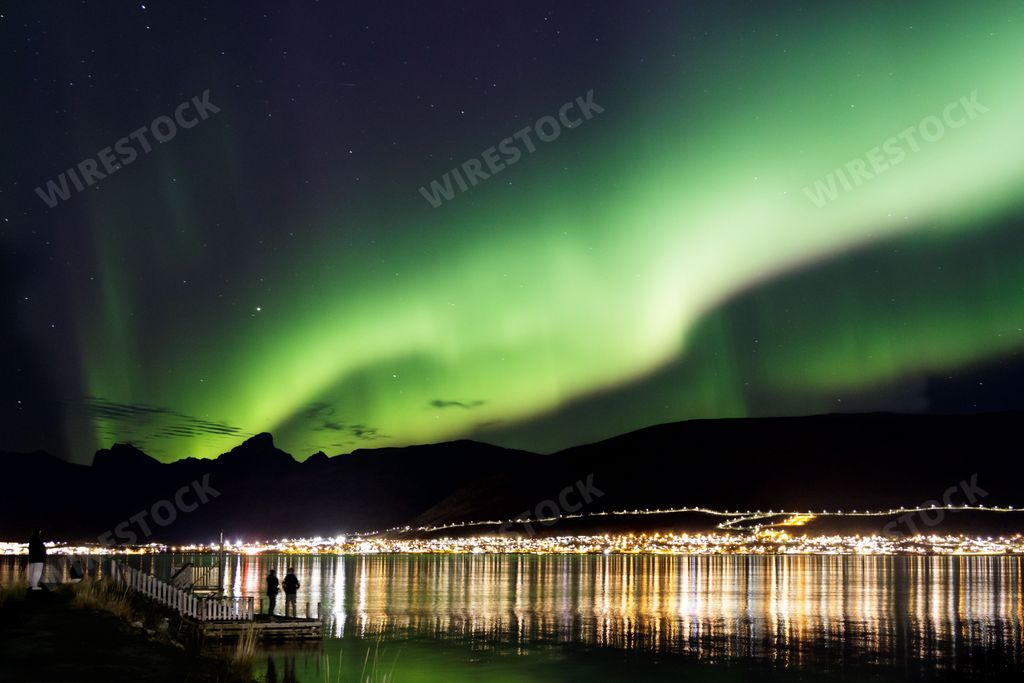 The Northern Lights over the mountains in Norway during the stary night