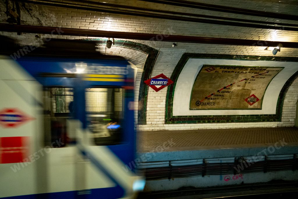 A metro wagon traveling through the Old Chamberi metro station in Madrid, Spain