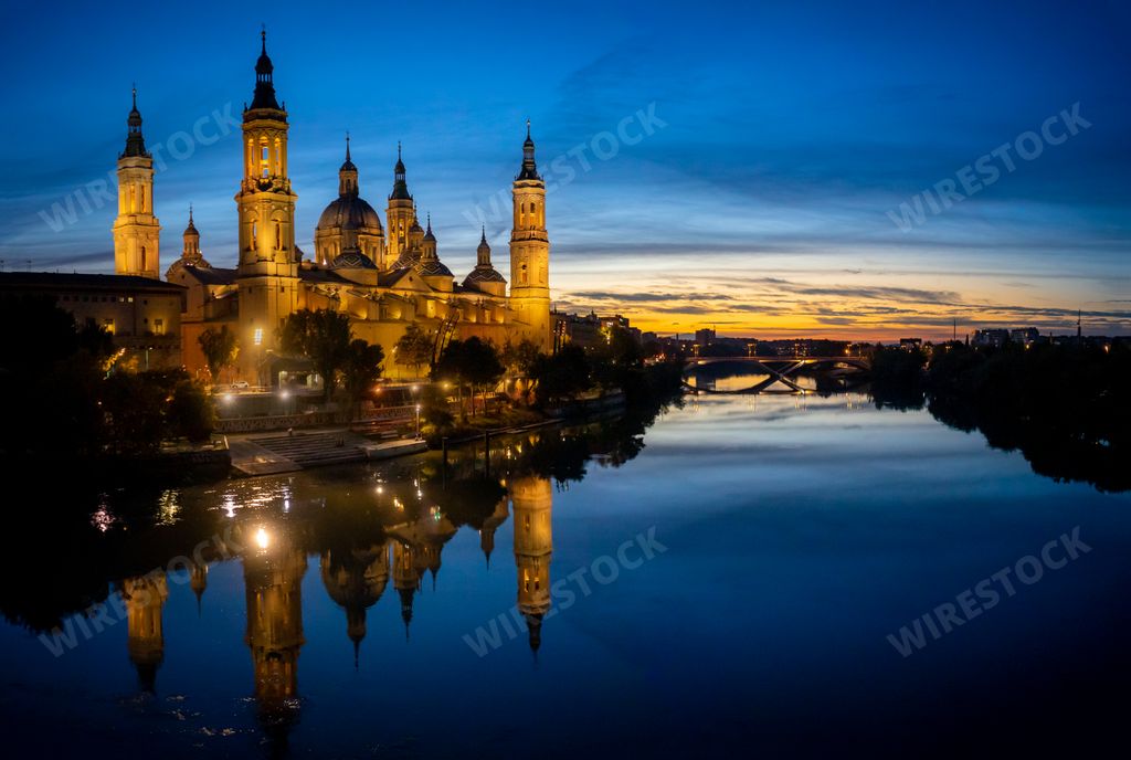 The Cathedral-Basilica of Our Lady of the Pillar with evening lights in the city of Zaragoza, Aragon