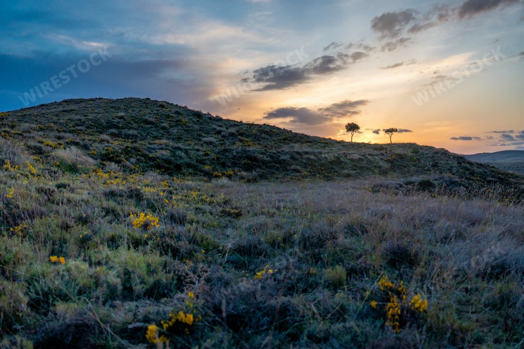 A mountain landscape at sunset