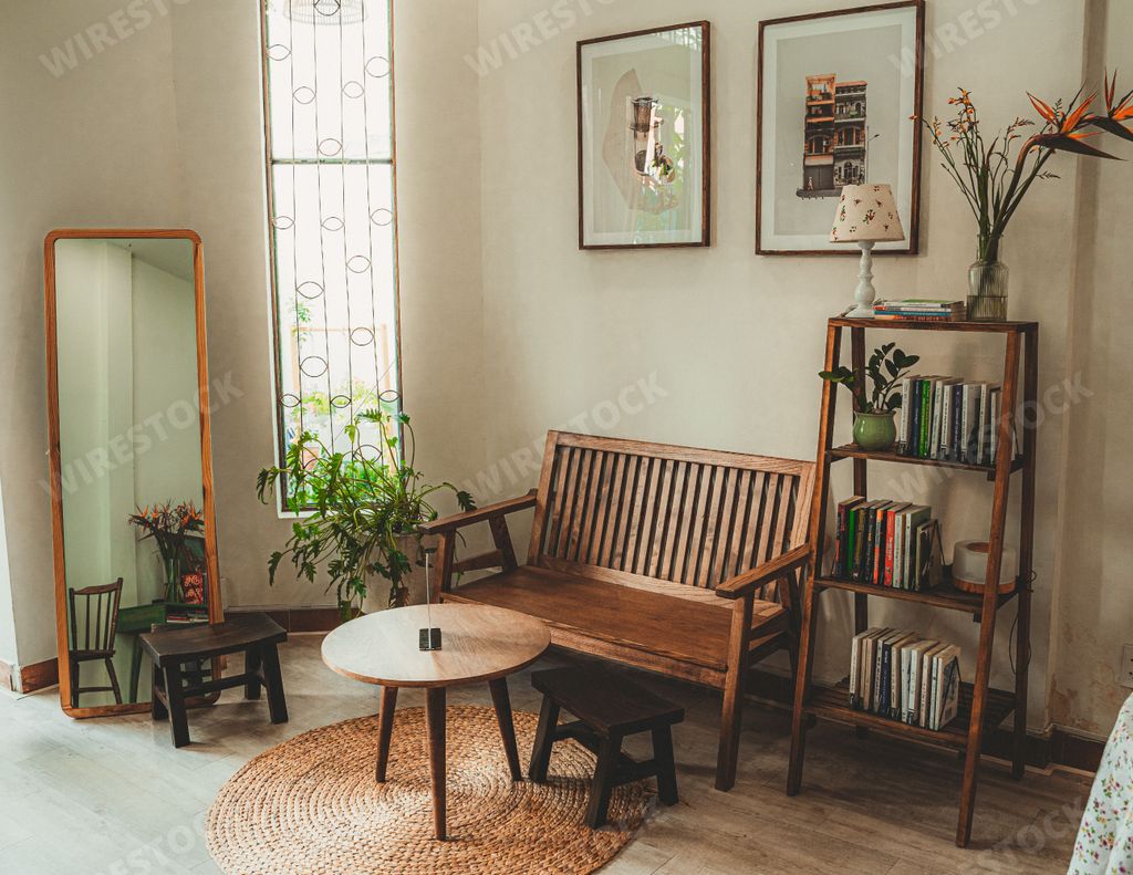A beautiful coffee shop interior with wooden seating and a bookshelf in Ho Chi Minh City, Vietnam