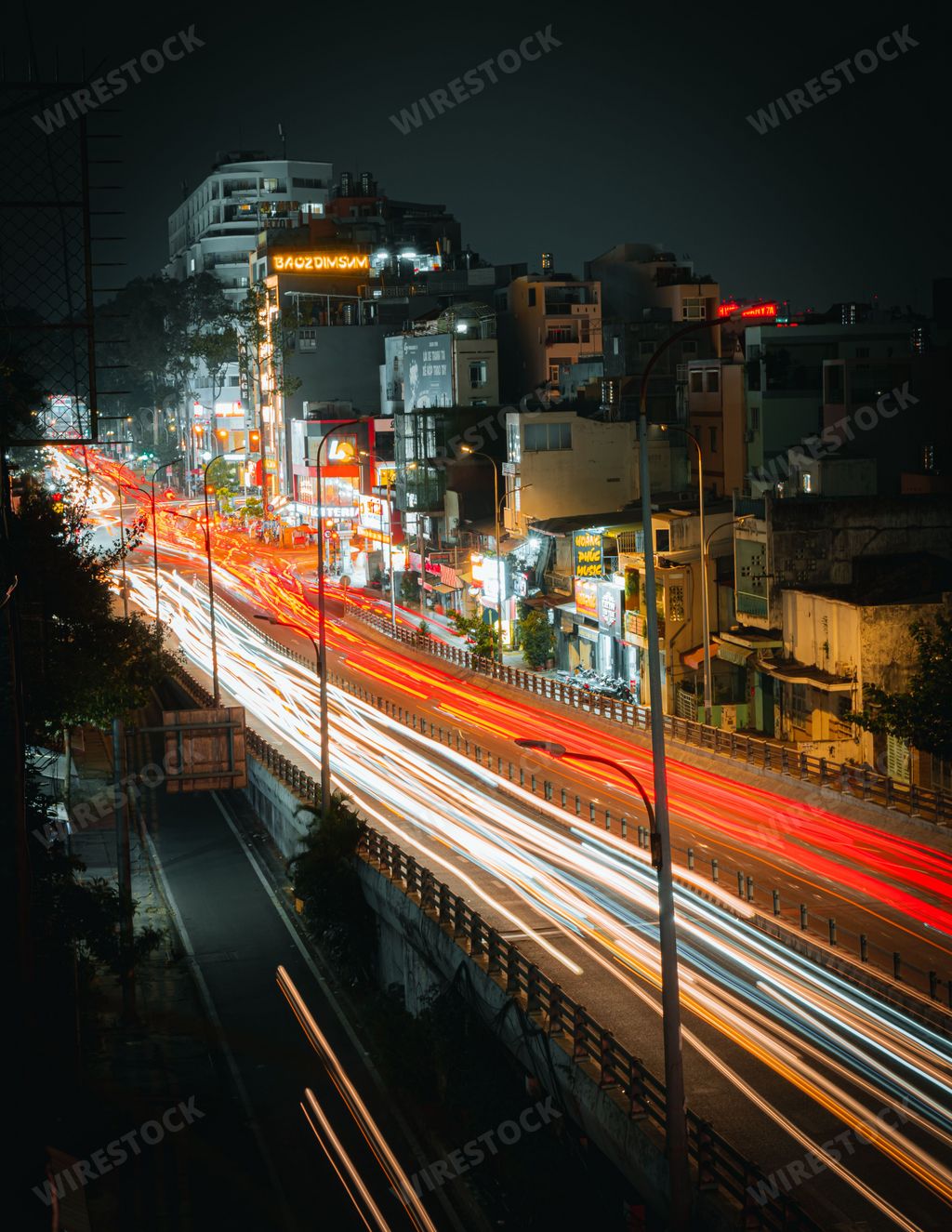 A long exposure of colorful light trails on the Nguyen Tri Phuong bridge in Ho Chi Minh, Vietnam