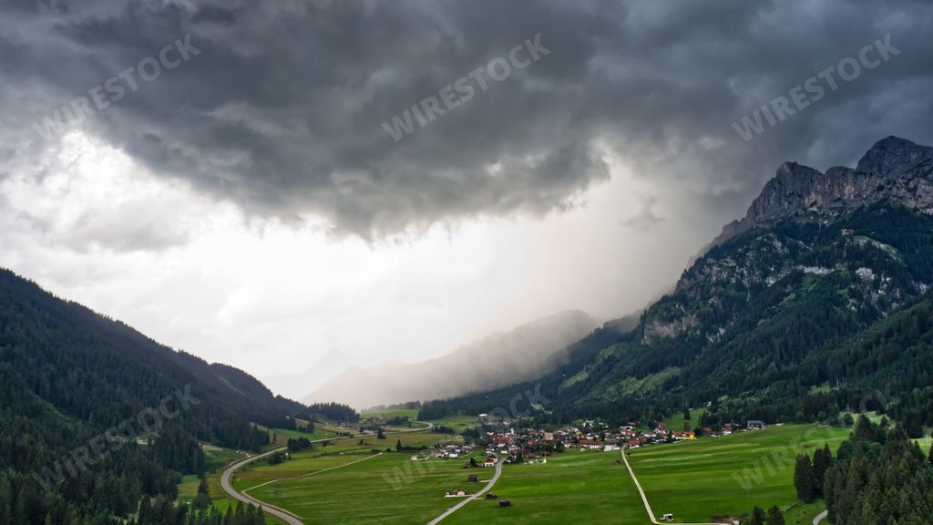 The gloomy sky over the flat fields and rocky landscapes