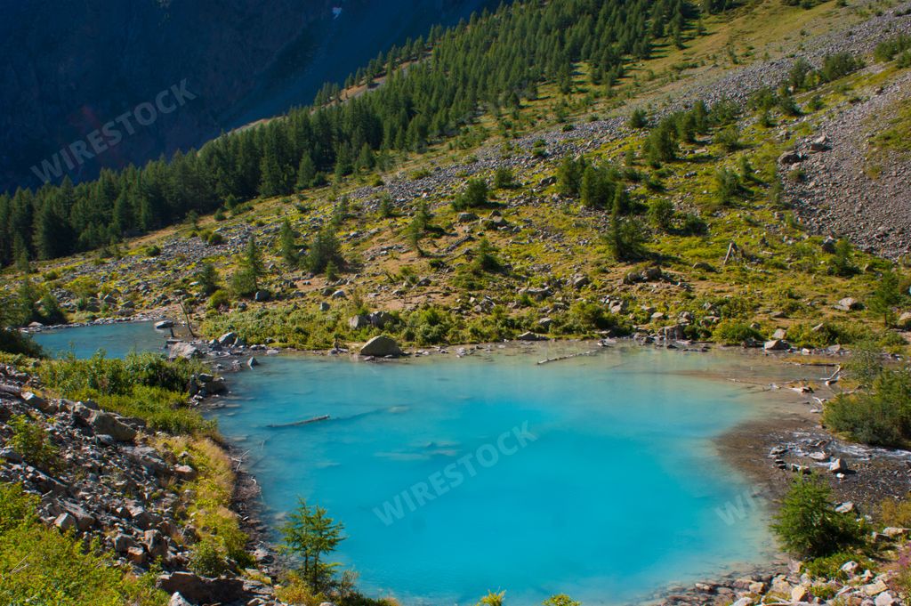 A beautiful green mountain with small lake douche in monetier, France