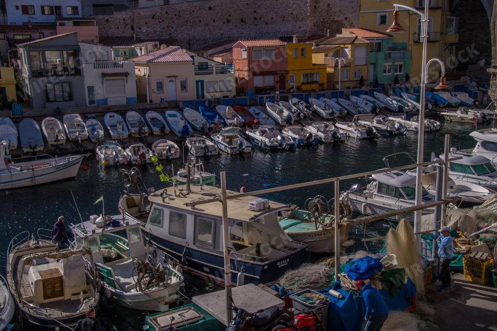 A beautiful view of boats in the water and buildings. Vallon des Auffes,  Marseille, France