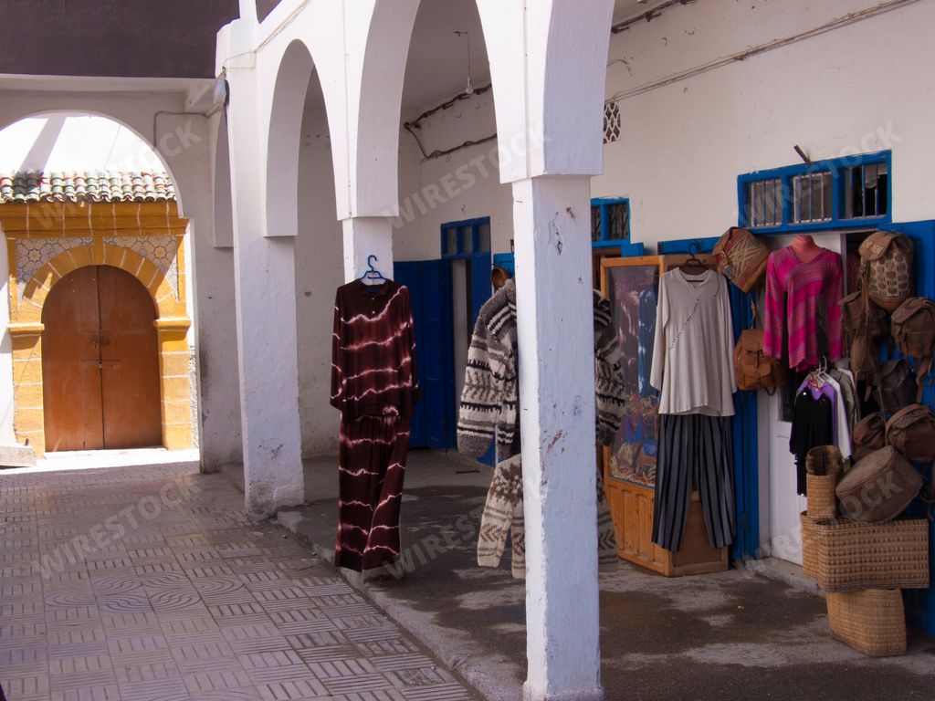 A market selling clothes inside a building in Essaouira, Morocco