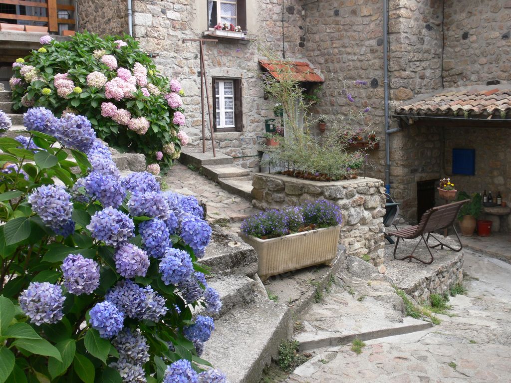 The buildings and flowers in Antraigues-sur-Volane ,Ardeche, France