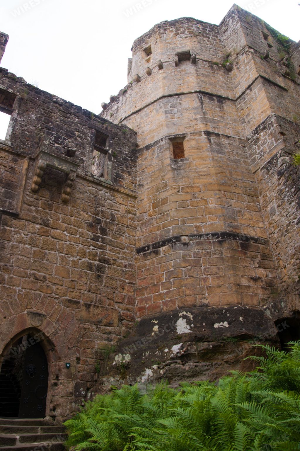A vertical low angle shot of the medieval Castle Beaufort, Luxembourg