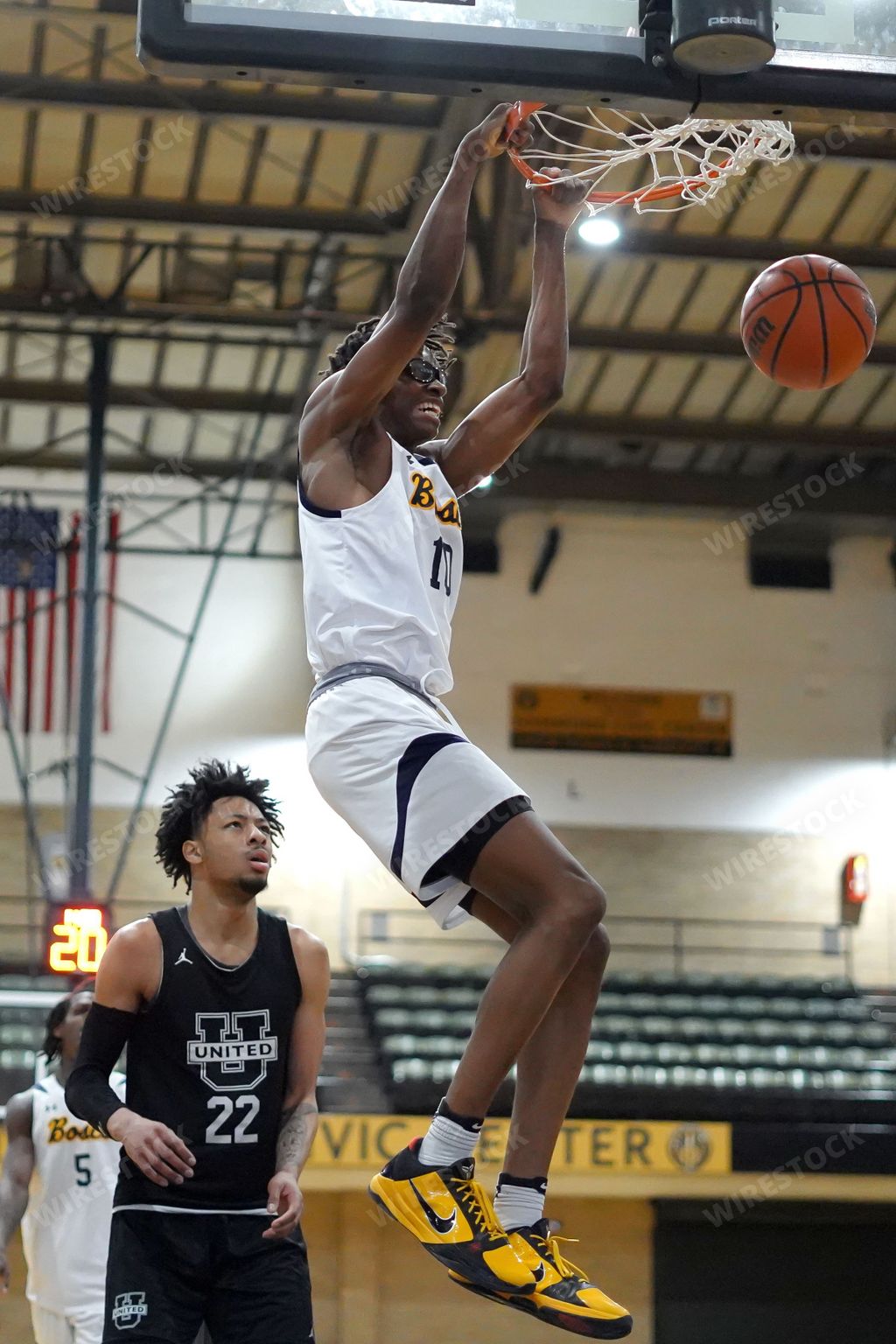A vertical of African Americans playing basketball at Bosco vs United Prep game in Hammond, Indiana