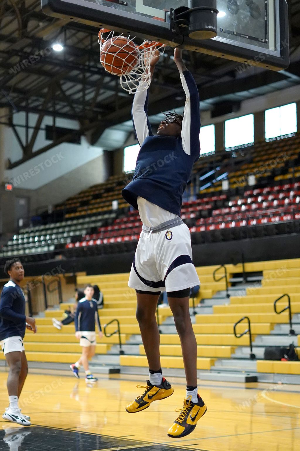 A vertical of African American guy playing basketball at Bosco vs United Prep game in Hammond, Indiana