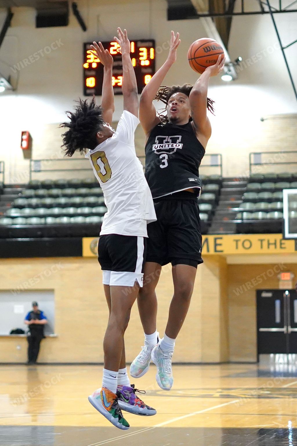 A basketball player shooting the ball into the hoop