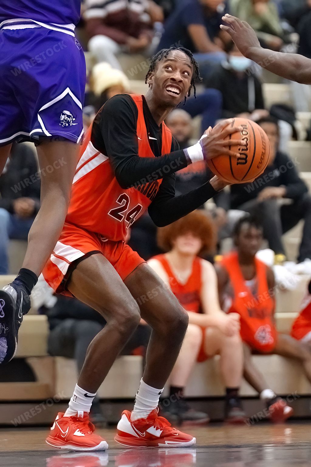 A vertical shot of young male players on the court at a fall Merrillville high school basketball game