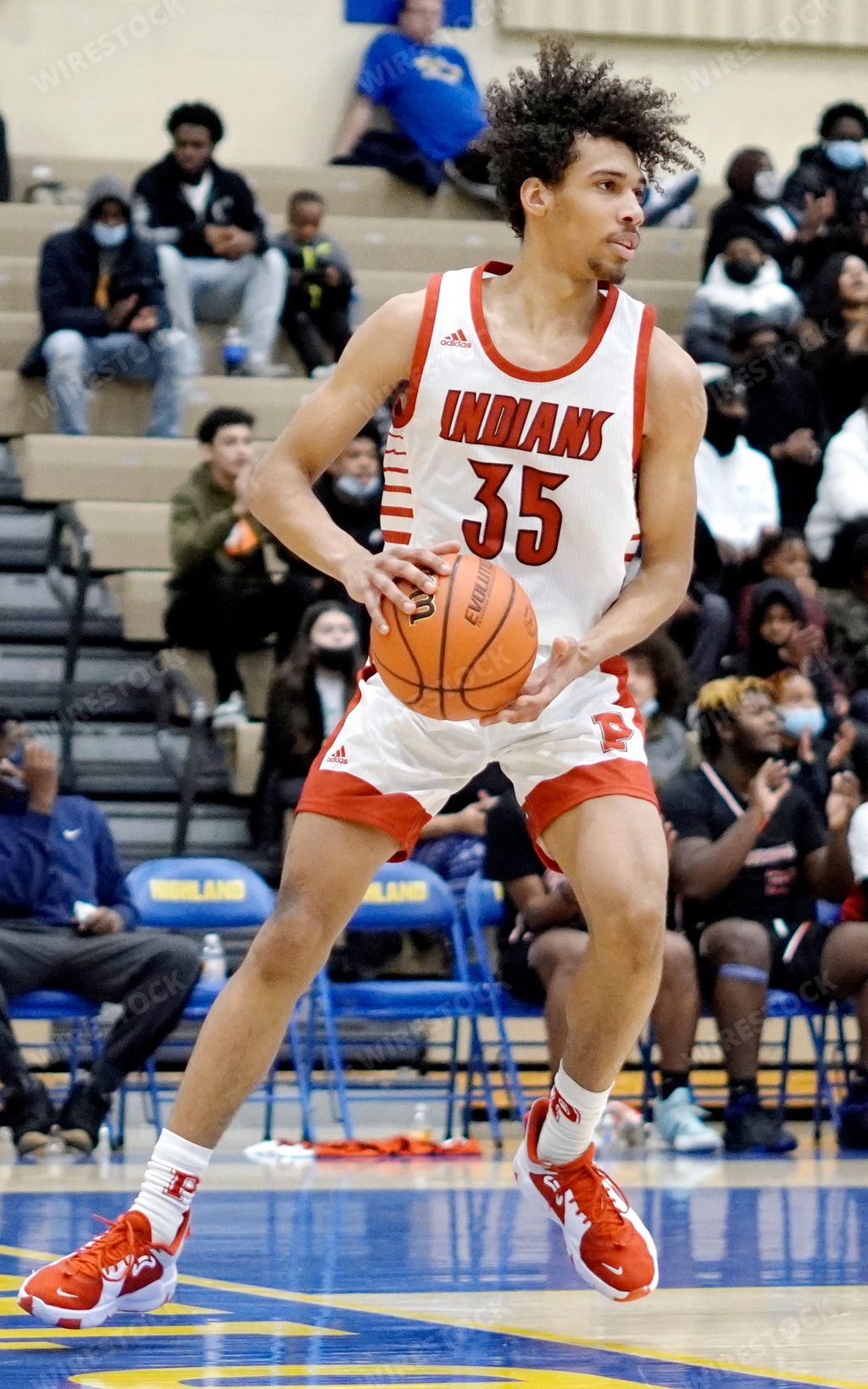 The basketball athletes during the Portage vs Hammond match competition  between the Morton  and Indiana High School basketball teams, vertical