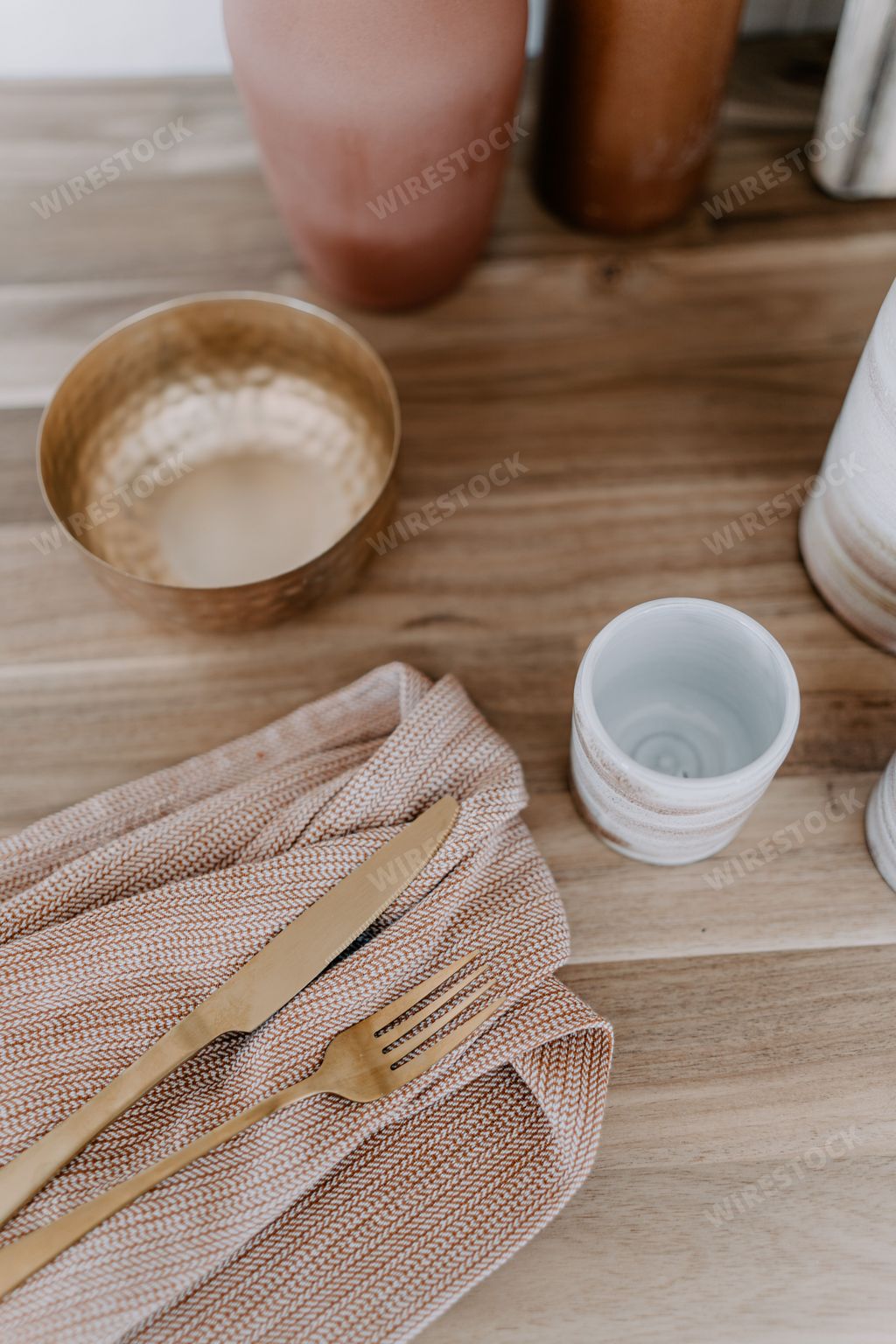 A rustic kitchen countertop with a selection of ceramic pots and bowls on display