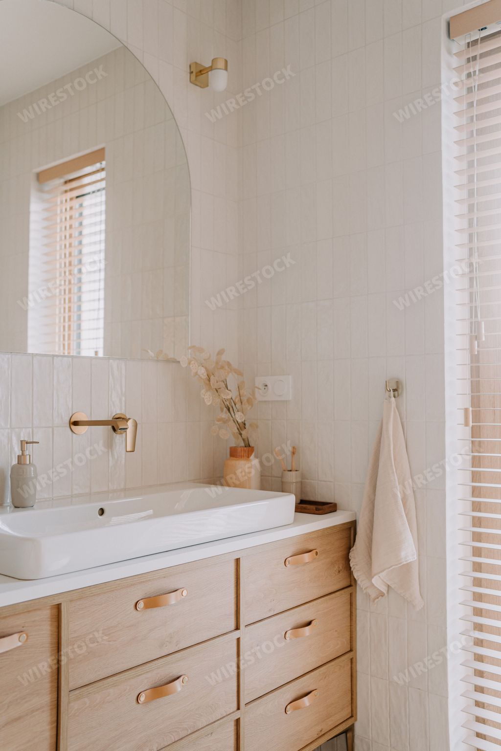 A modern bathroom features a unique vanity with contemporary designs and decor elements