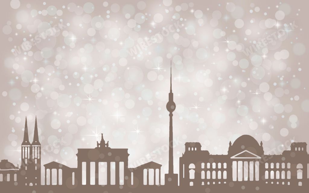 A silhouette background of Berlin buildings with bokeh snow - Christmas concept