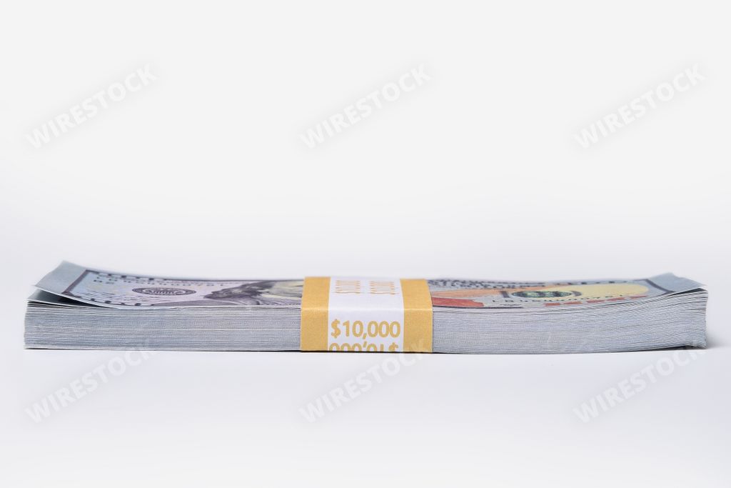 A stack of ten thousand American dollars isolated on white background