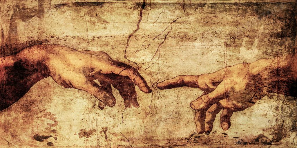 A painting of creation of Adam by Michelangelo at the Sistine chapel