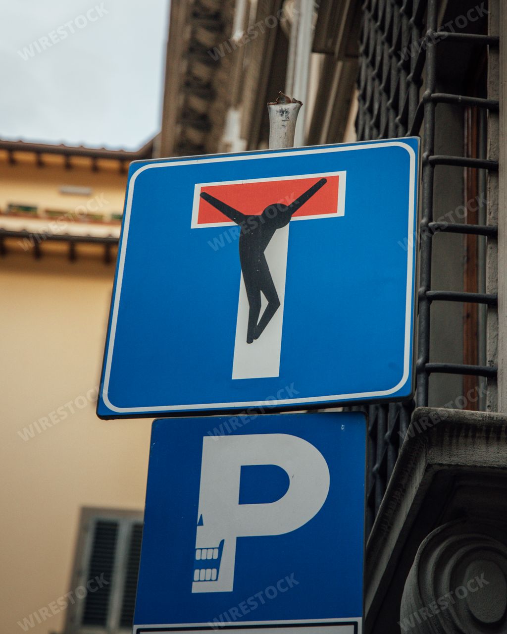 A vertical shot of altered street signs