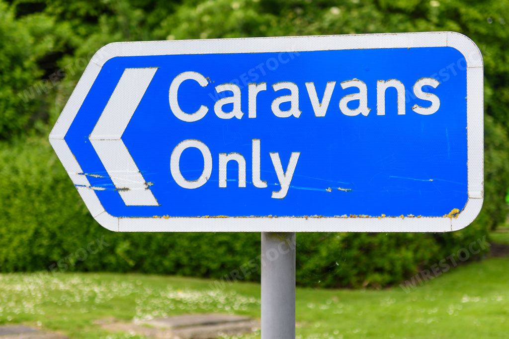 Caravans only road sign at a motorway services on the M5, indicating parking for caravans only at the services.