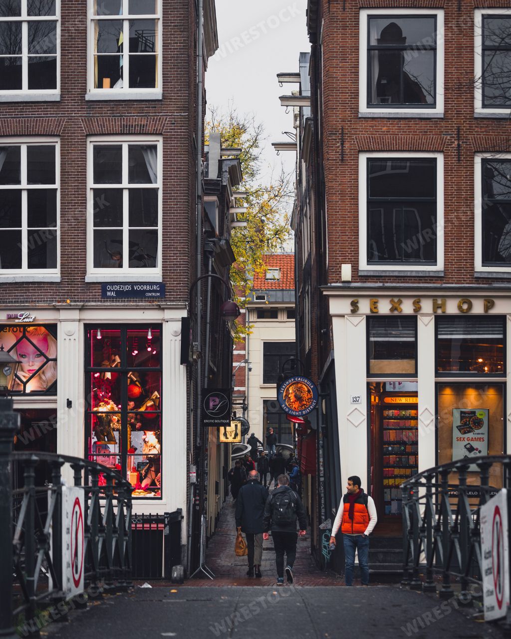 Amsterdam, Netherlands - November 27 2022: A view down Stoofsteeg, an alleyway in the De Wallen red light district in Amsterdam.
