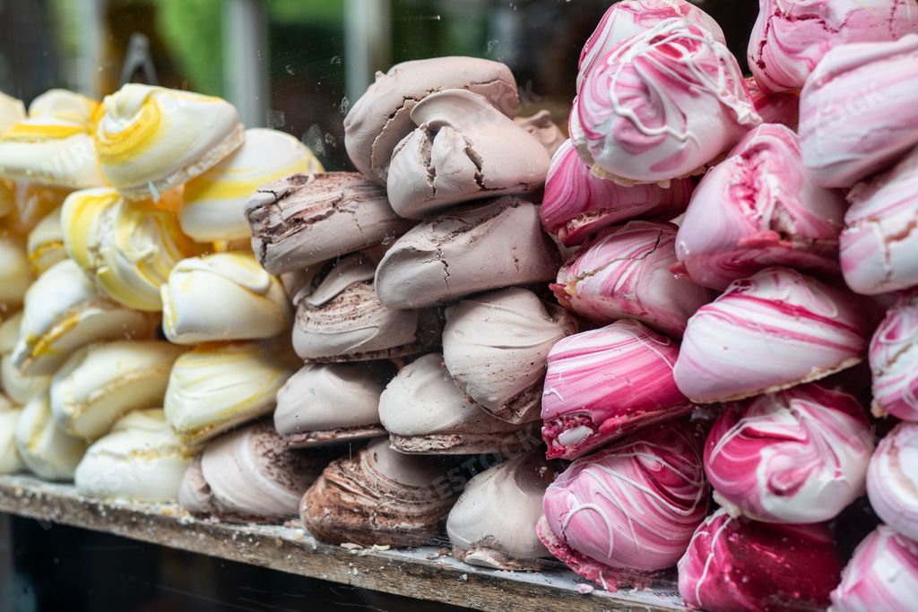 A pile of colourful meringues are displayed in a shop window in Amsterdam. The popular treat is a delicacy with locals and tourists.