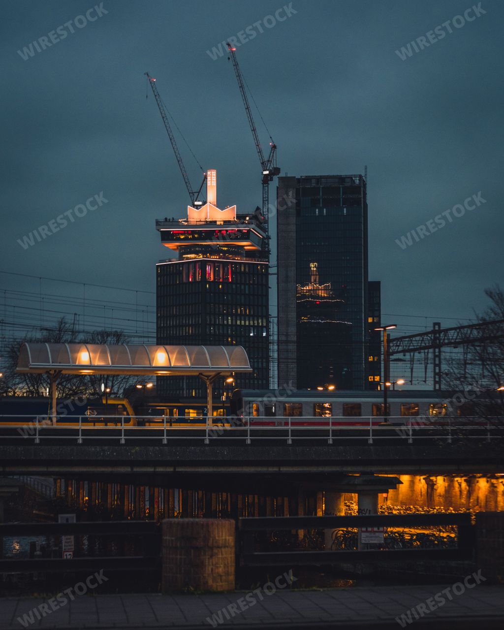 Amsterdam, Netherlands - November 27 2022: A night time view of A'DAM Toren, the famous tower in Amsterdam with rooftop viewing and swing.
