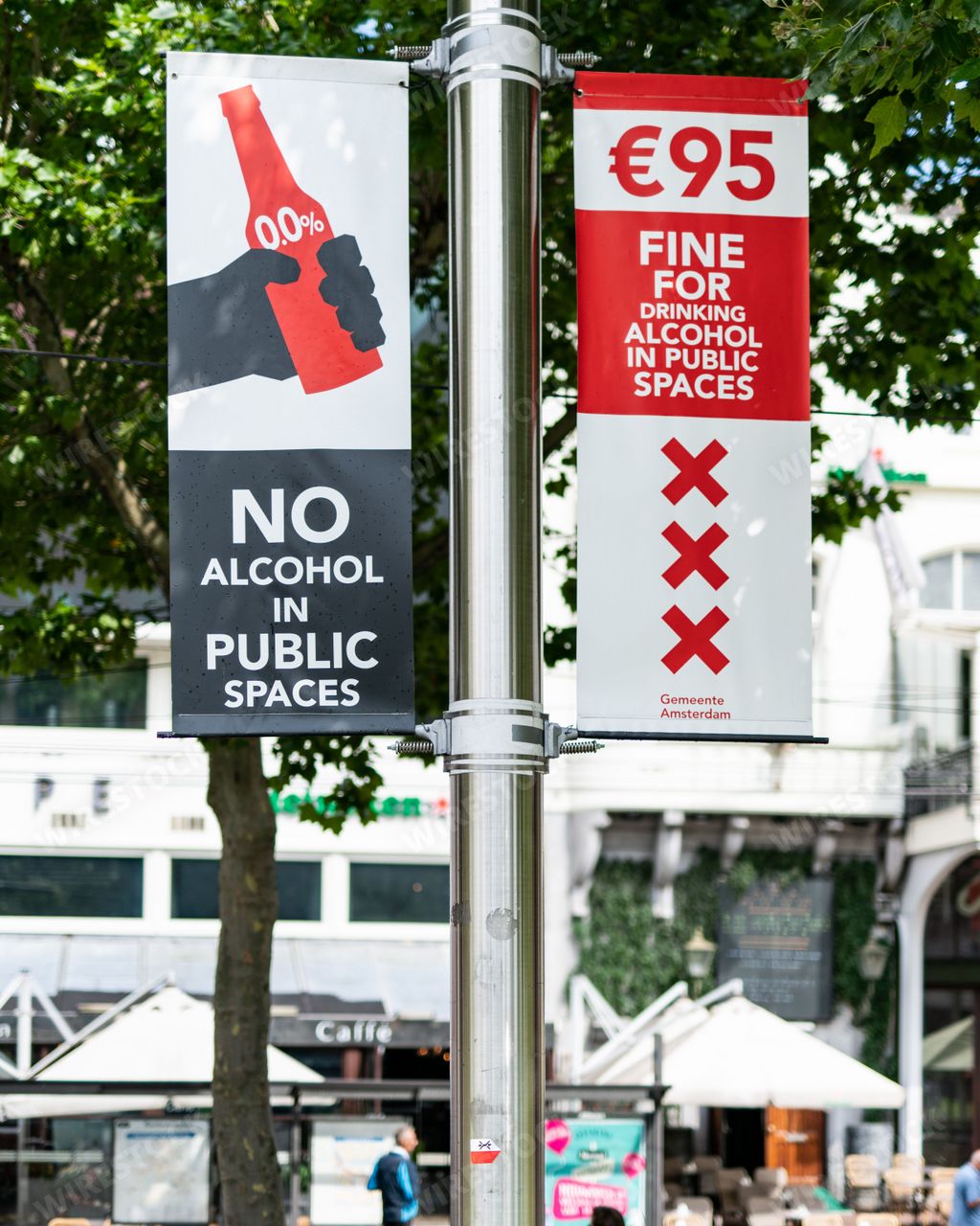 Street signs in Amsterdam warn people drinking alcohol in public is illegal and they will be fined 95EUR.