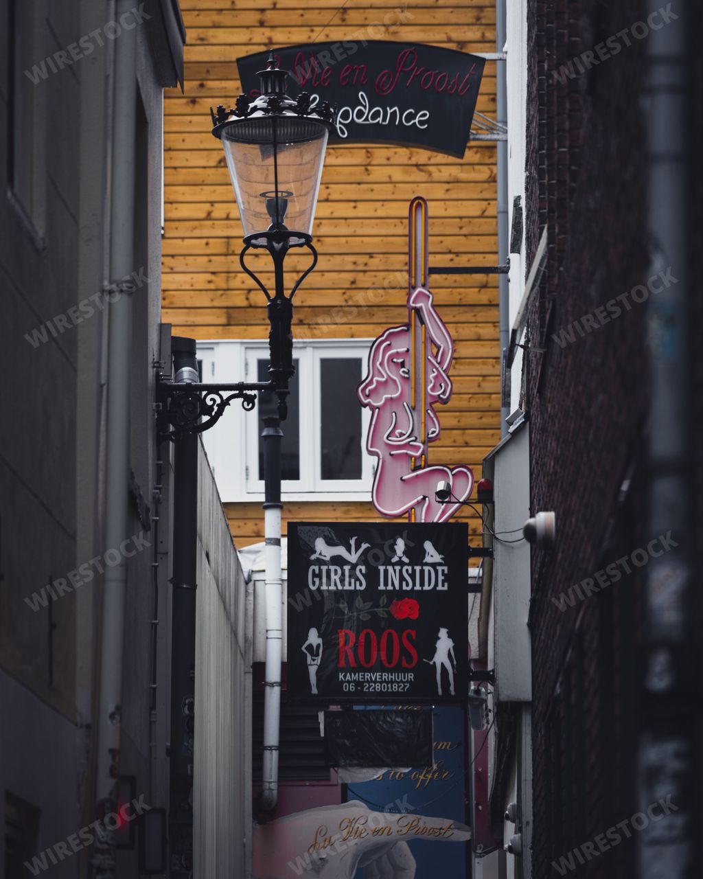 Amsterdam, Netherlands - November 27 2022: A view down Bethlehemsteeg, an alleyway in the De Wallen red light district in Amsterdam.