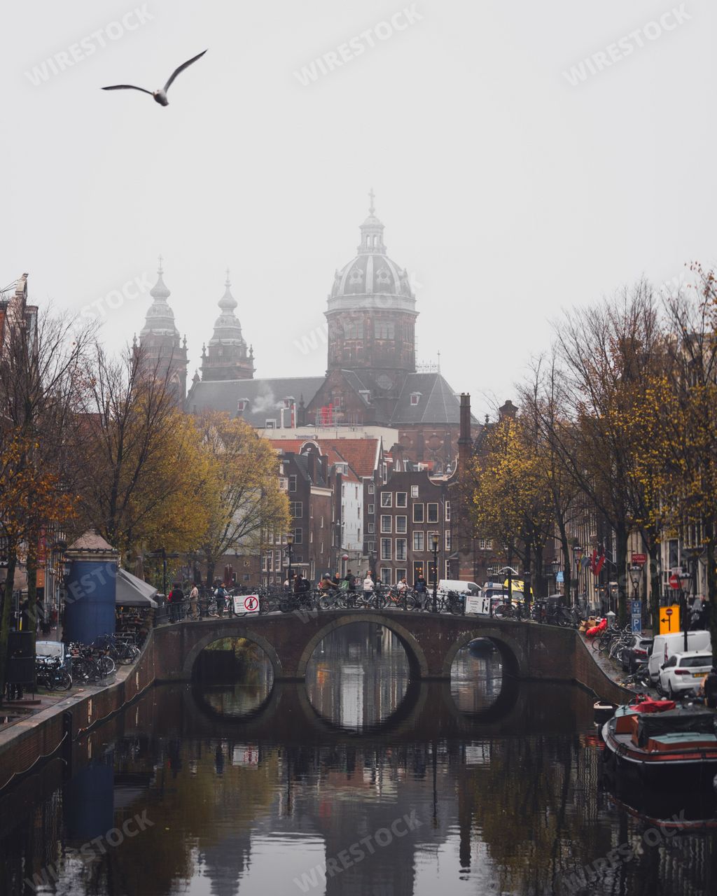 Amsterdam, Netherlands - November 27 2022: The Basilica of St Nicholas on a foggy day, as seen from the De Wallen red light district.