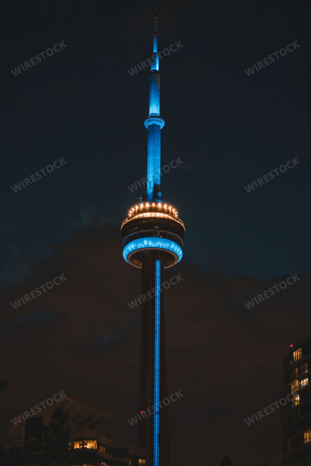 A brightly-lit CN Tower at night in Toronto, Canada