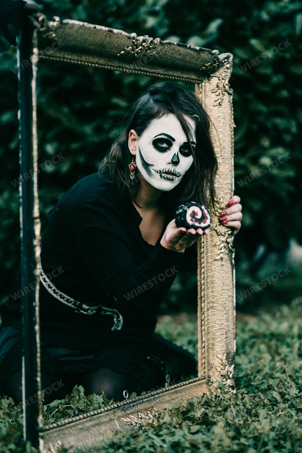 A Serbian woman wearing a skeleton face during Halloween