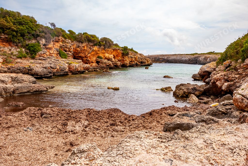 The view of the rocky coast. Random beach near Cala Millor, Majorca, Spain.