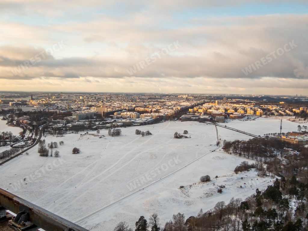 An aerial view of the beautiful snowy city of Stockholm under the cloudy sky in Sweden