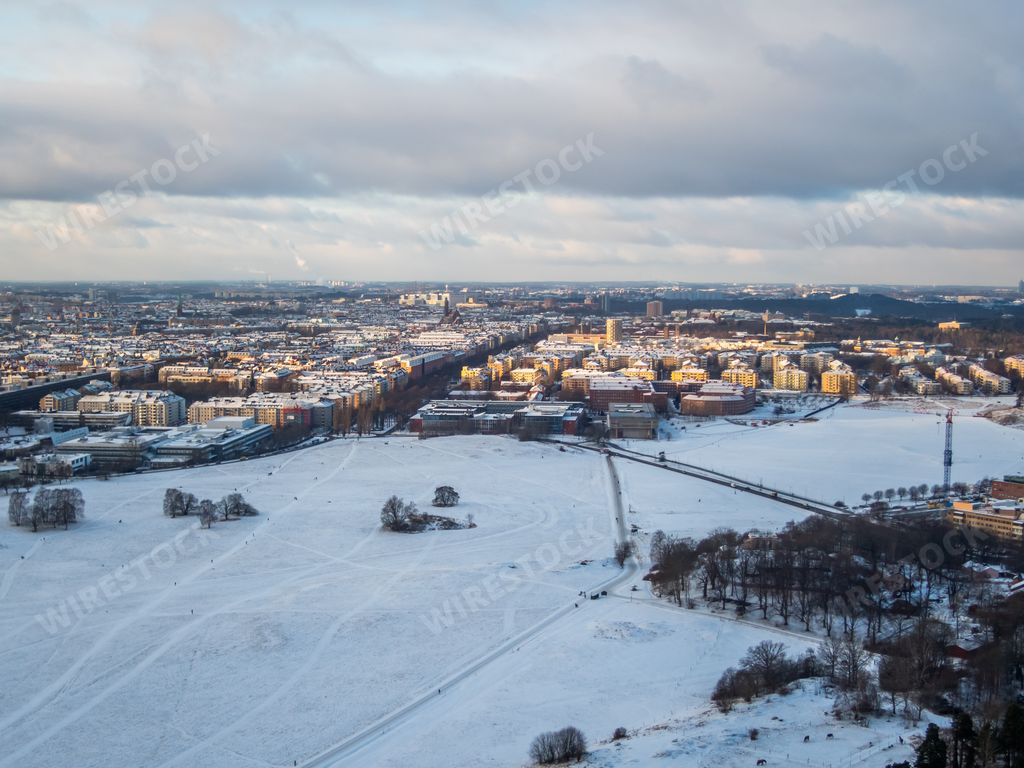 An aerial view of the beautiful snowy city of Stockholm under the cloudy sky in Sweden