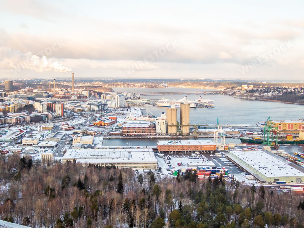 An aerial view of the beautiful snowy city of Stockholm under the cloudy sky in Sweden