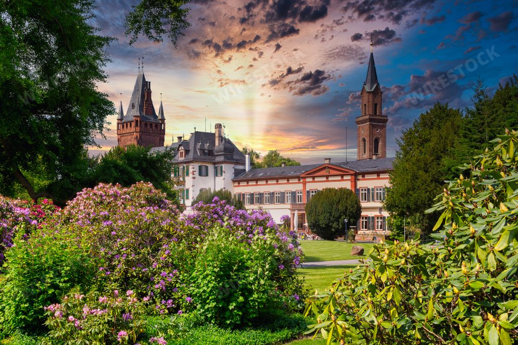 Weinheim castle park Old Town view during sunset with sun flare, hessen, germany